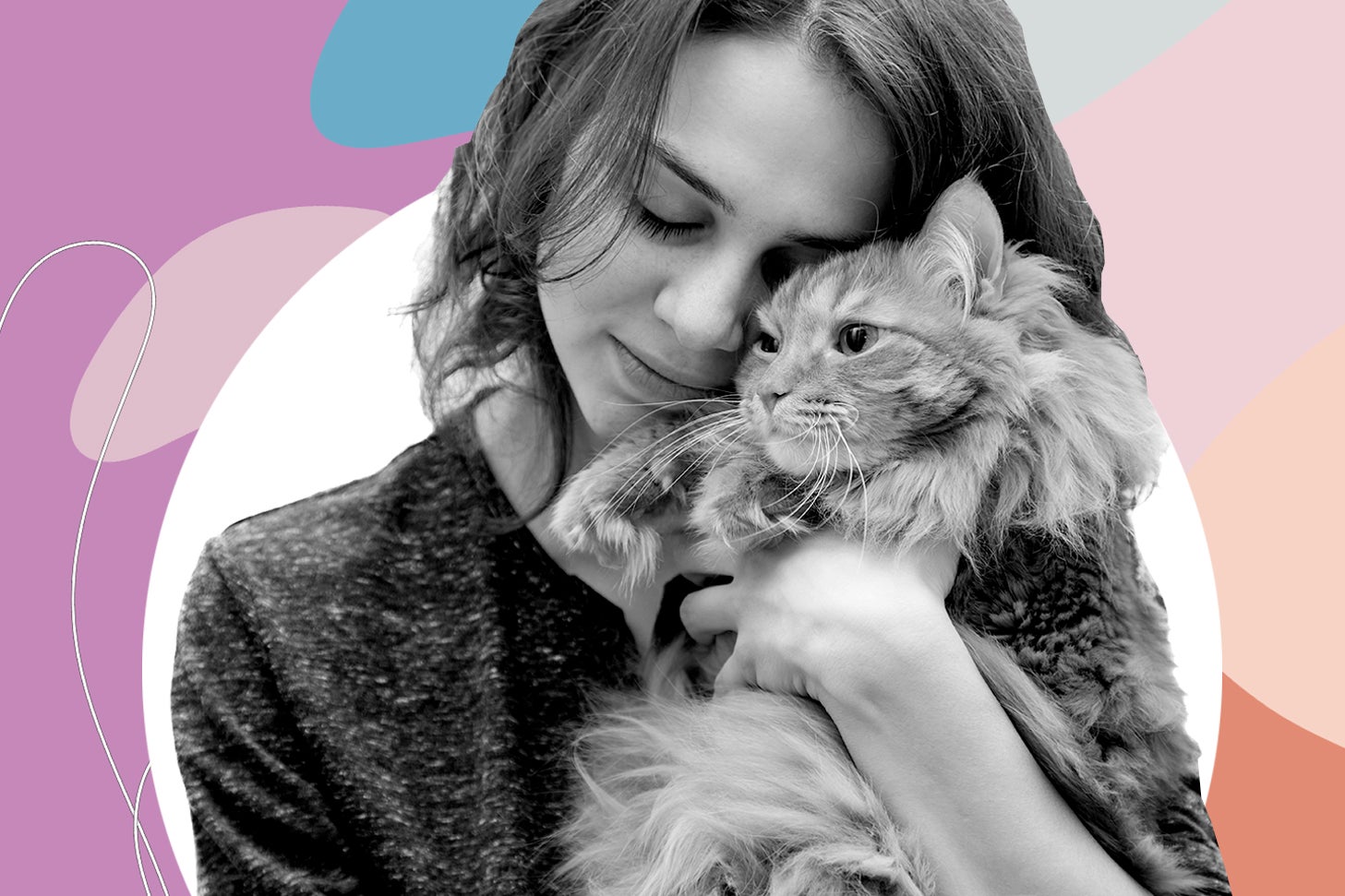 Woman hugging a furry cat.