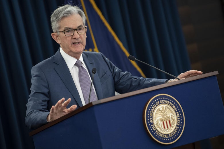 Federal Reserve Chairman Jerome Powell speaking at a podium