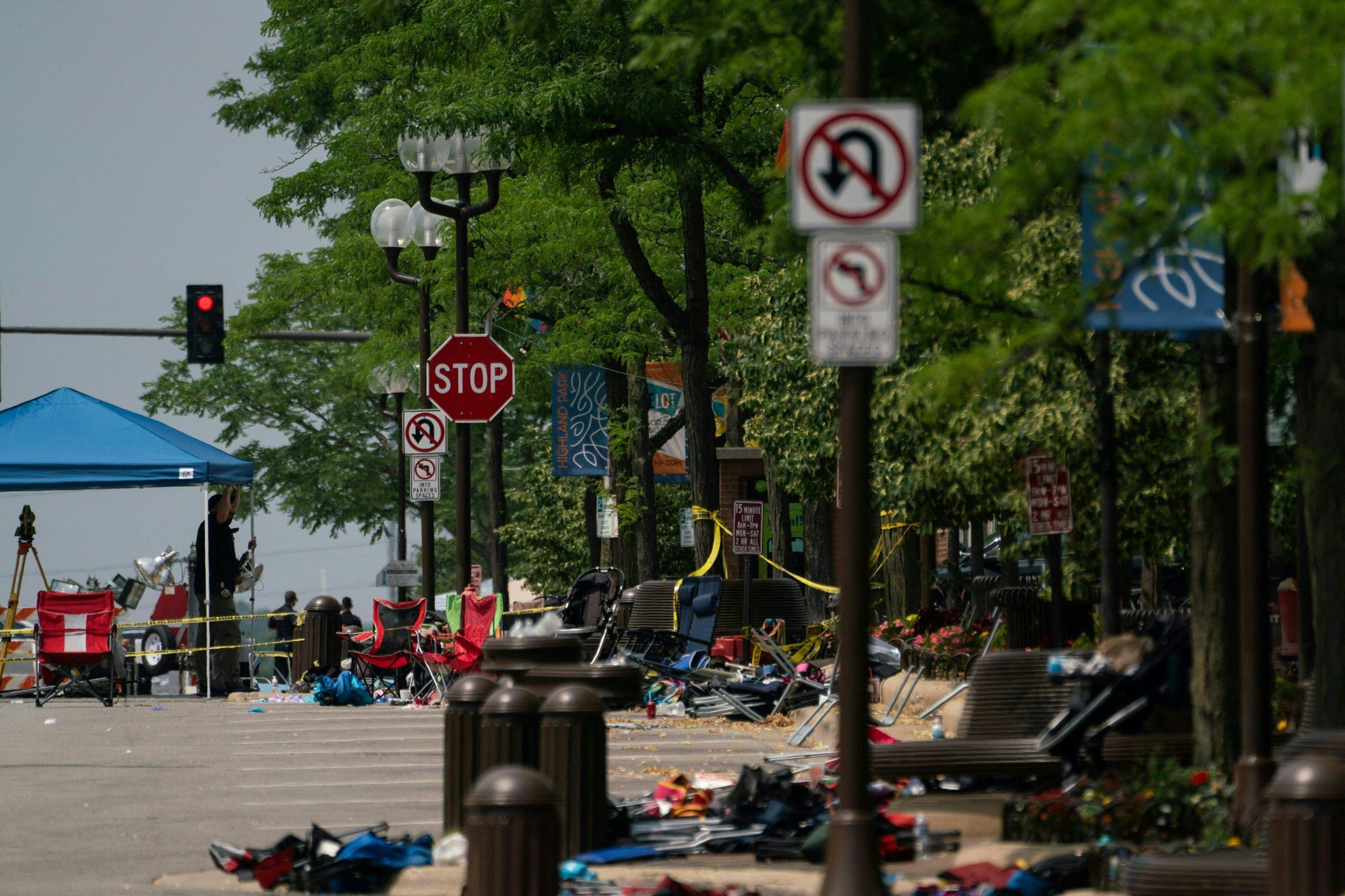 Chairs and belongings are seen left behind at the scene of a mass shooting at a July 4th Parade in downtown Highland Park, Illinois on July 5, 2022. 