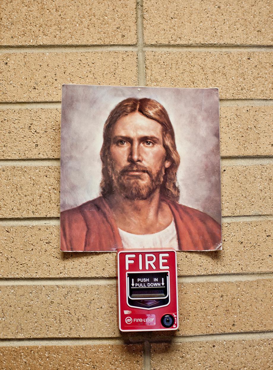 A picture of the most common representation of Jesus in the Mormon Church was stuck on top of a fire alarm at the Missionary Training Center where young men and women go to train for 3 months before leaving on their two year mission. 