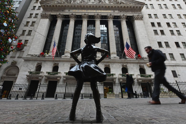 The Fearless Girl statue facing the New York Stock Exchange Building