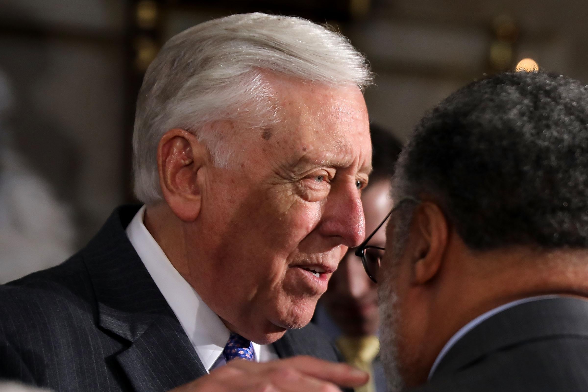 WASHINGTON, DC - APRIL 12:  House Minority Whip Steny Hoyer (D-MD) (L) talks with the Smithsonian's National Museum of African American History and Culture founding Director Lonnie Bunch at the conclusion of a ceremony to mark the 50th anniversary of the assassination of Dr. Martin Luther King Jr. with House Minority Leader Nancy Pelosi (D-CA) (L) and Speaker of the House Paul Ryan (R-WI) in Statuary Hall at the U.S. Capitol April 12, 2018 in Washington, DC. The House of Representatives memorialized the day that Nobel Peace Prize and American civil rights leader King was killed while supporting a sanitation workers strike in Memphis, Tennessee.  (Photo by Chip Somodevilla/Getty Images)