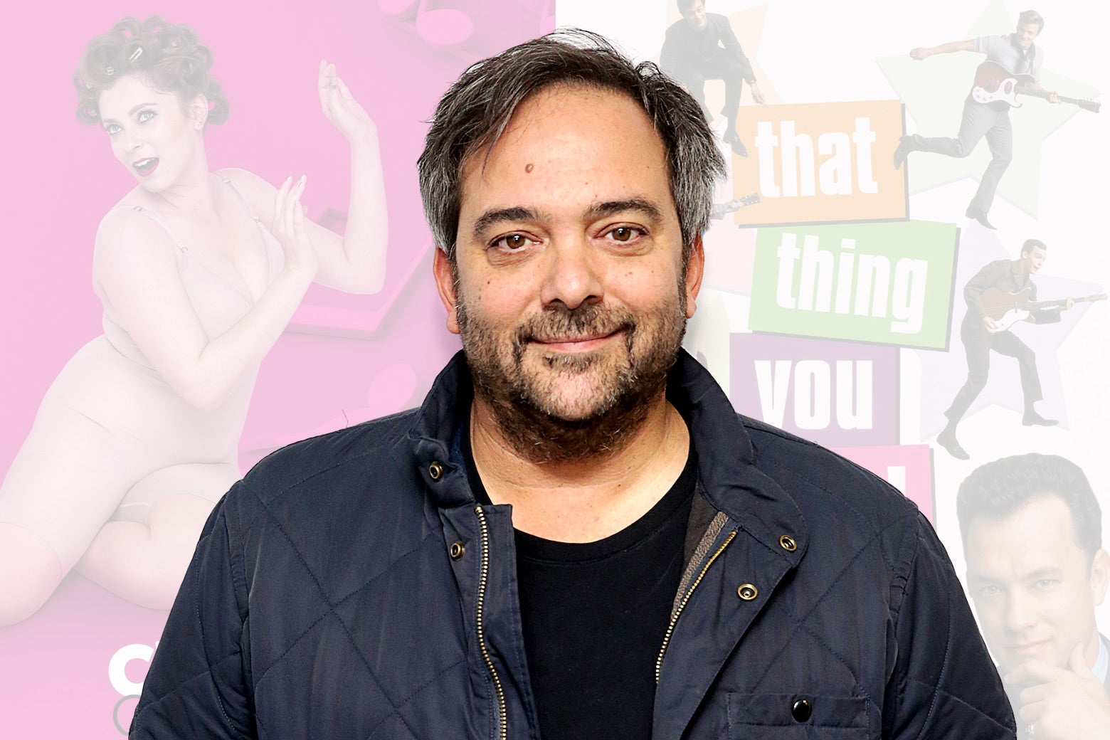 Adam Schlesinger is seen in front of faded posters for Crazy Ex-Girlfriend and That Thing You Do!