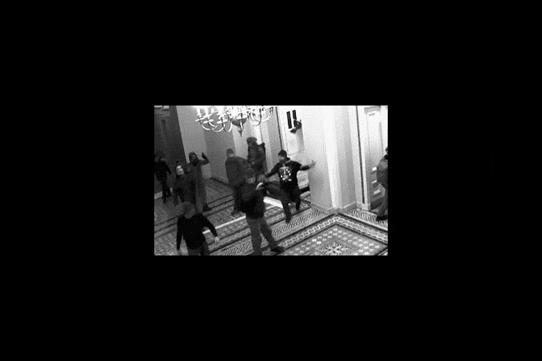A GIF of rioters breaking into the Capitol.