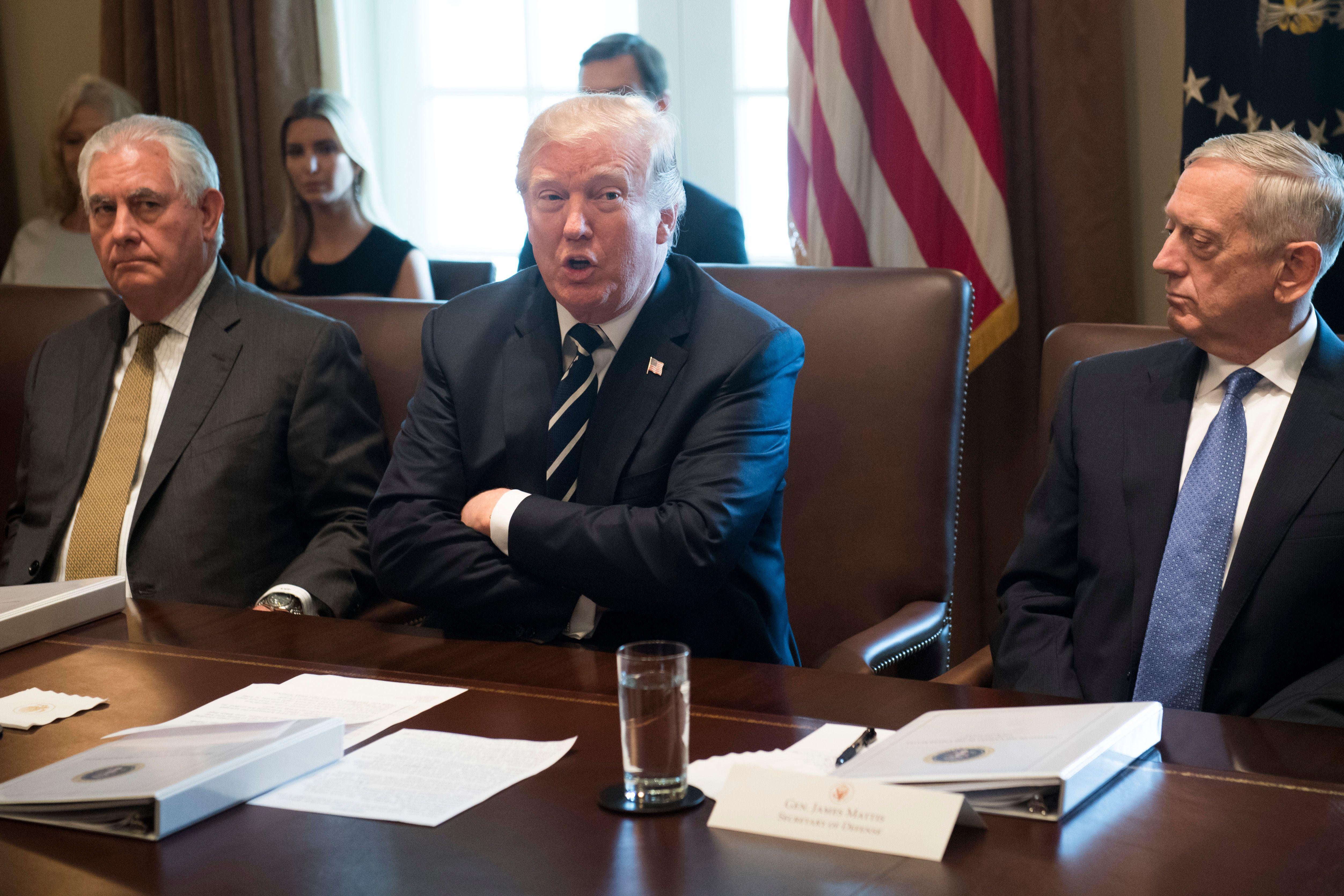 US President Donald Trump speaks (C) alongside Secretary of State Rex Tillerson (2L) and Secretary of Defense James Mattis during a Cabinet Meeting in the Cabinet Room of the White House in Washington, DC, October 16, 2017. / AFP PHOTO / SAUL LOEB        (Photo credit should read SAUL LOEB/AFP/Getty Images)