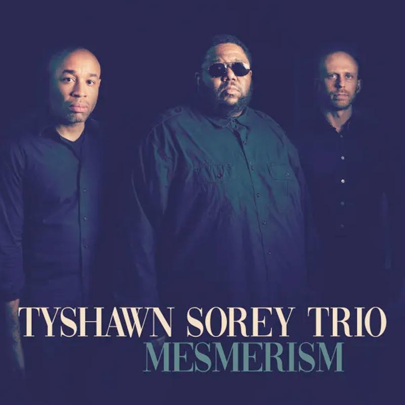 The trio is pictured on the cover of Mesmerism.