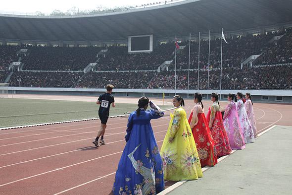 Will Philipps completes the marathon in the 50,000-seat stadium.