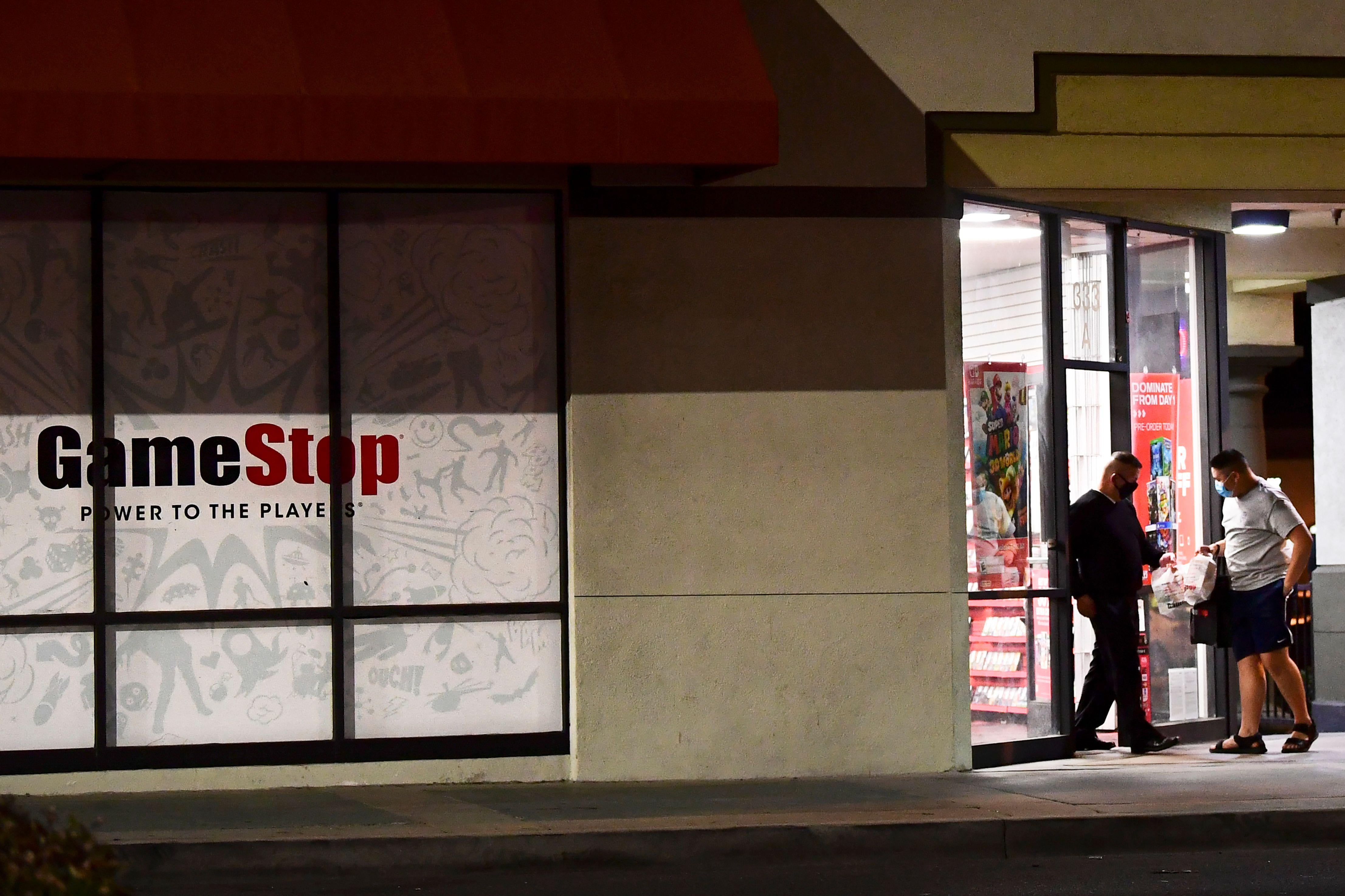 Customers step out of a GameStop store in Alhambra, California.