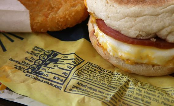 Nutritional information is printed on the wrapper of a McDonald's Egg McMuffin.