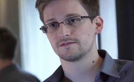 In this handout photo provided by The Guardian, Edward Snowden speaks during an interview in Hong Kong.