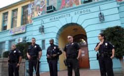 Police stand outside Miramonte Elementary School in Los Angeles, California February 6, 2012.