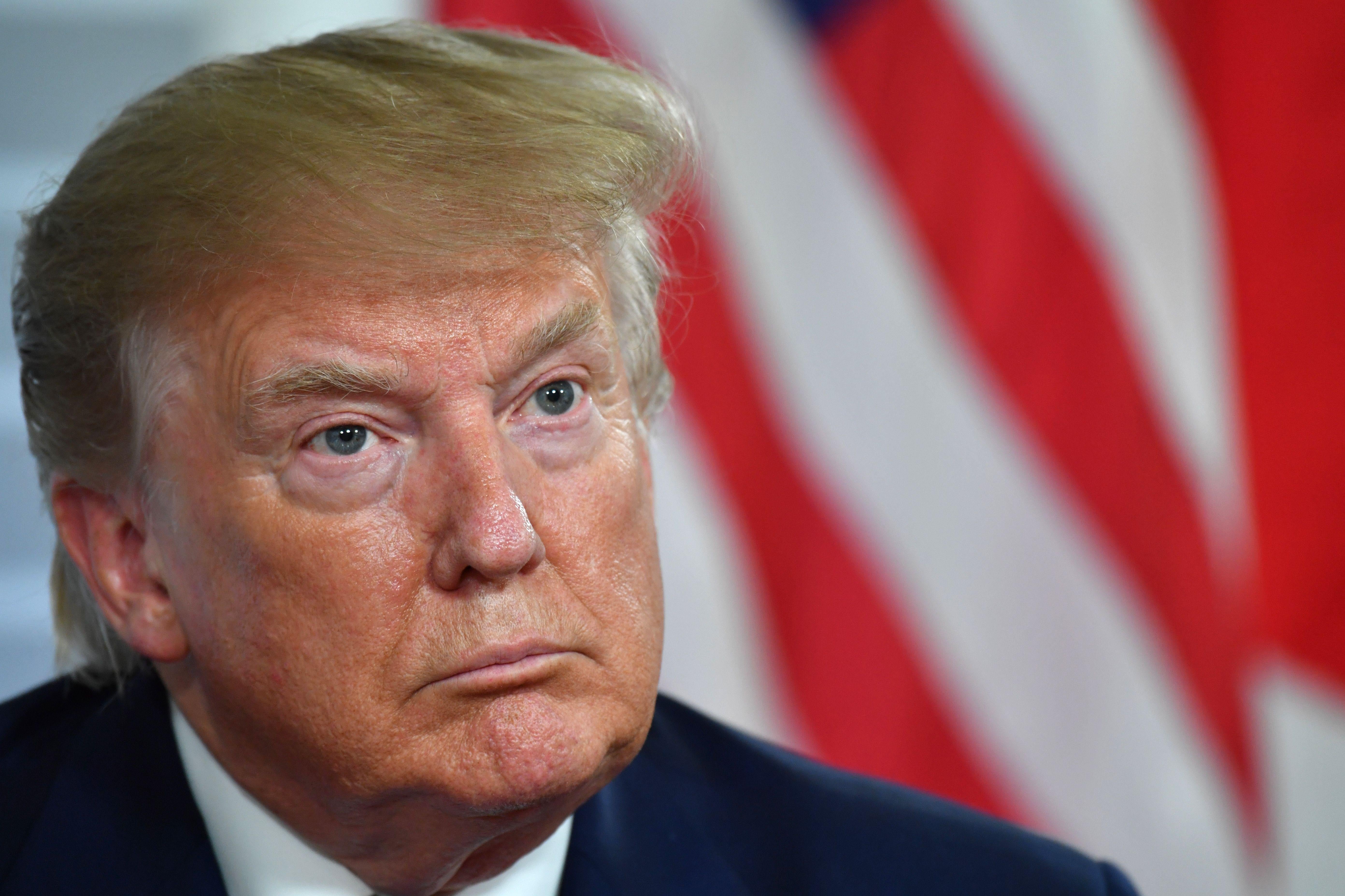 President Donald Trump listens to Shinzo Abe during a bilateral meeting.