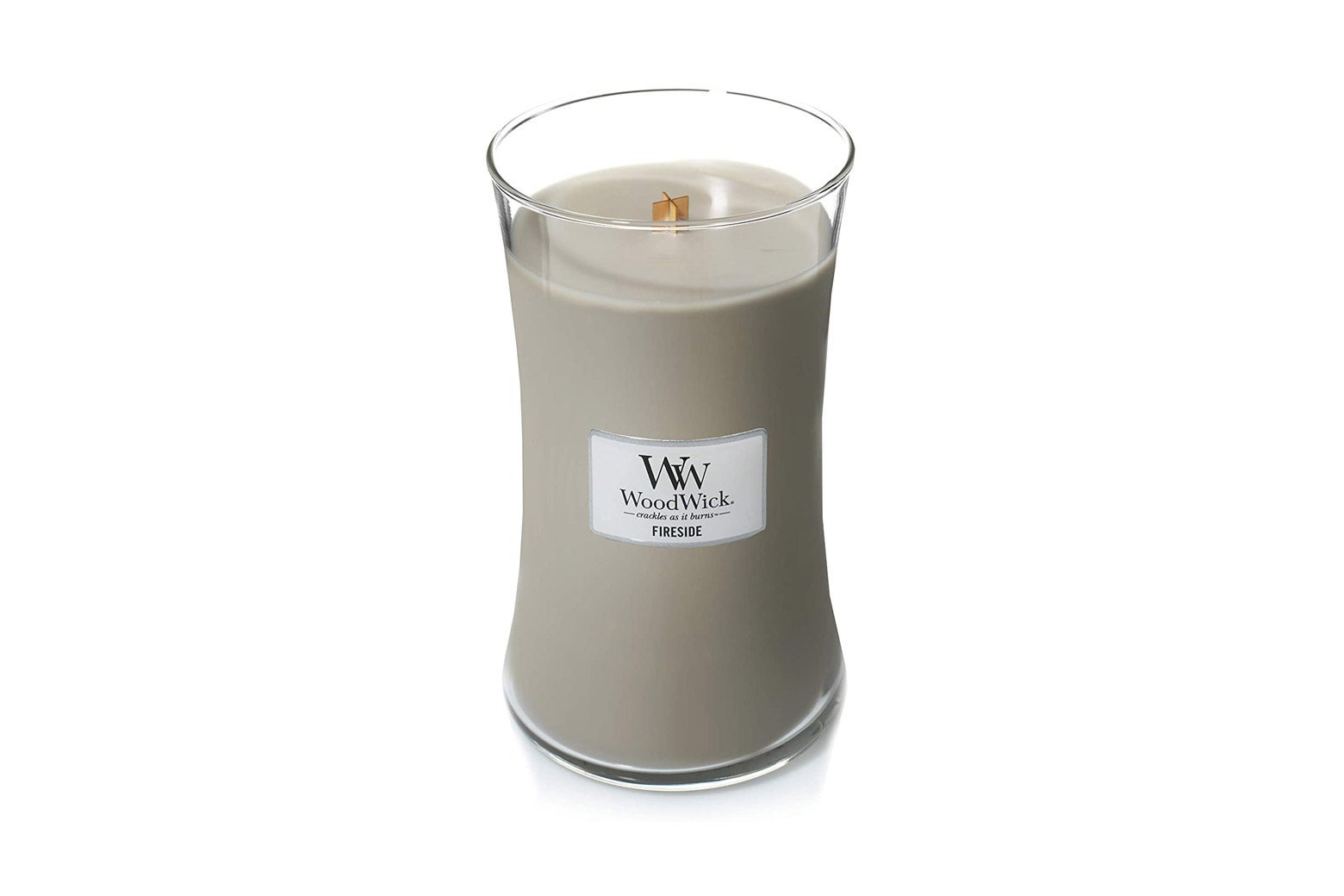 A cream-colored WoodWick candle.