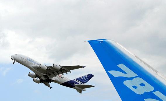 The vertical stabilizer of a Boeing 787 Dreamliner is seen as an Airbus A380.