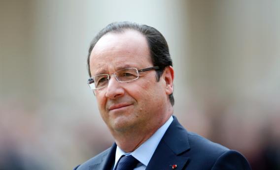 France's President Francois Hollande attends a military ceremony in the courtyard of the Invalides in Paris, on June 14, 2013.