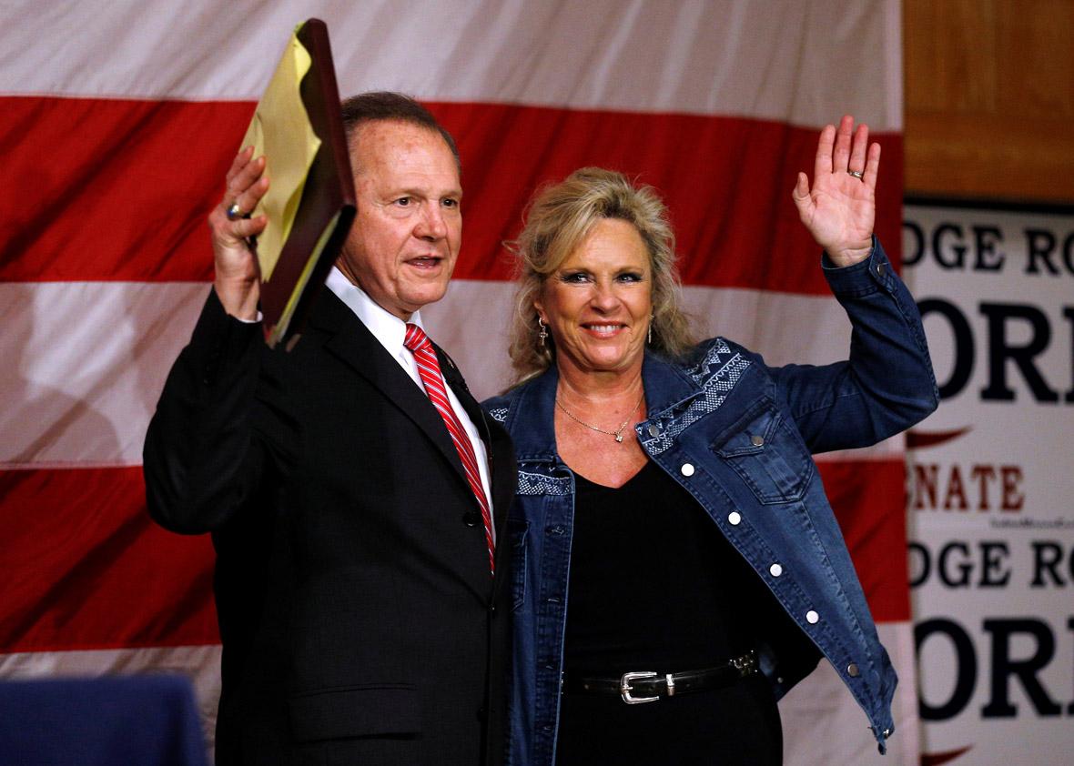 Republican candidate for U.S. Senate Judge Roy Moore and his wife Kayla wave to the crowd during a campaign rally in Fairhope, Alabama, U.S., December 5, 2017.