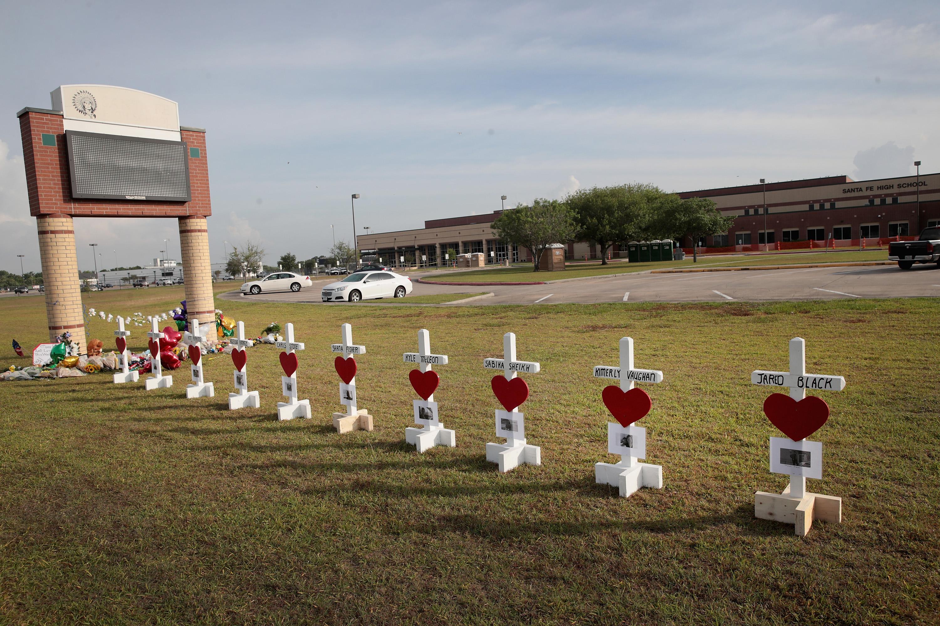 Crosses line the lawn in front of Santa Fe High School in Texas. 