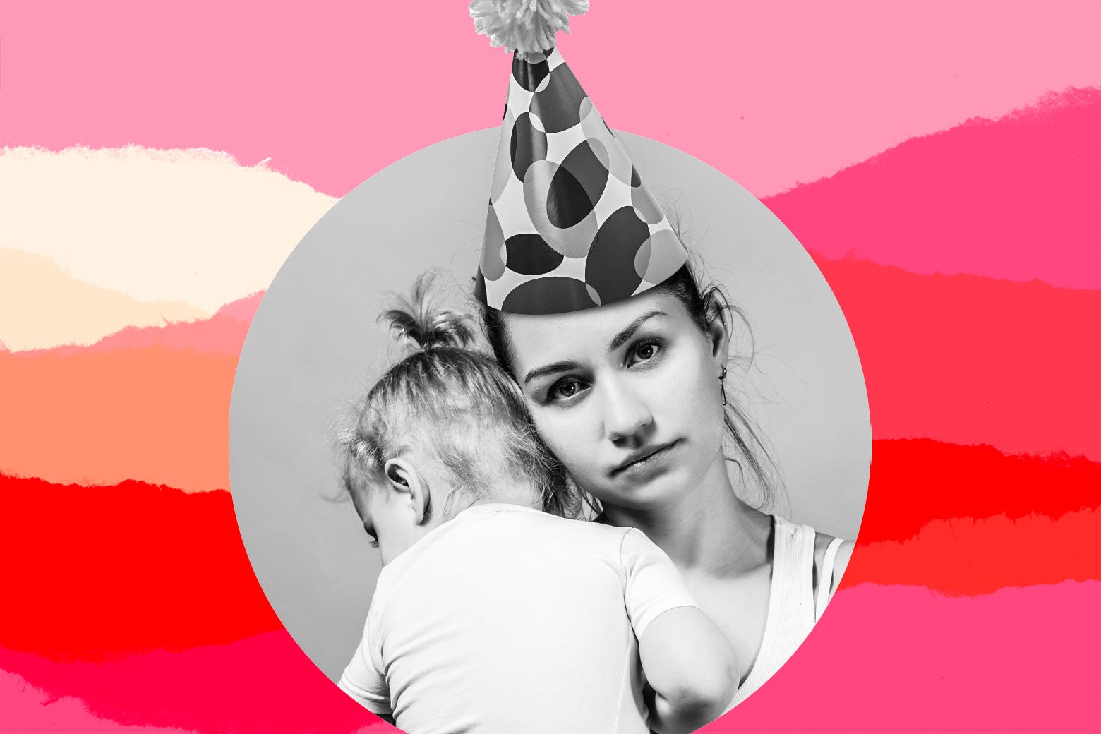 A person wearing a birthday hat holds a toddler.