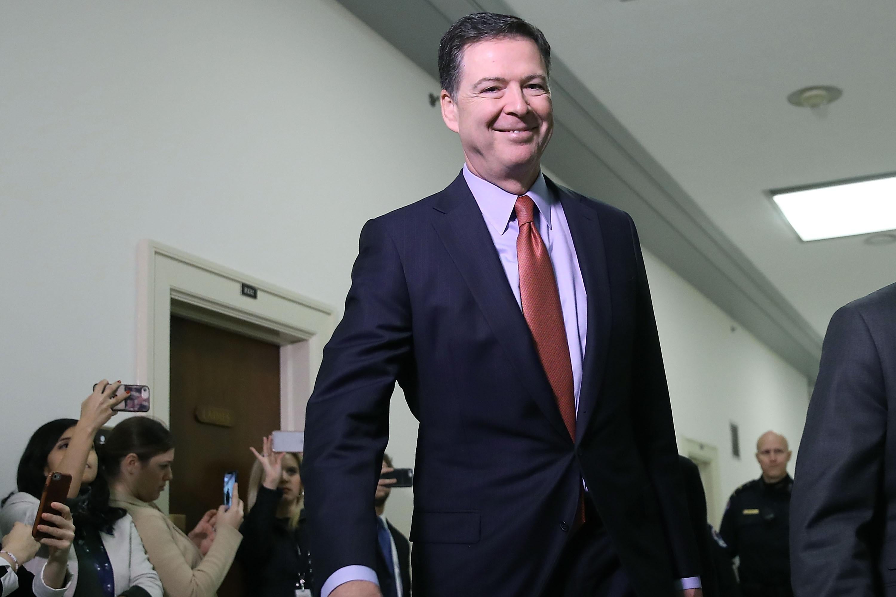 Former Federal Bureau of Investigation Director James Comey arrives at the Rayburn House Office Building before testifying to the House Judiciary and Oversight and Government Reform committees on Capitol Hill on December 17, 2018 in Washington, D.C. 