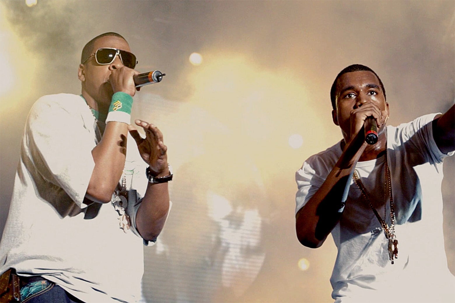 Jay-Z and Kanye West performing on stage.