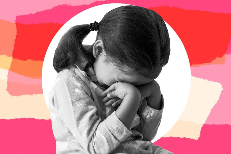 A toddler girl has a tantrum against a pink background.
