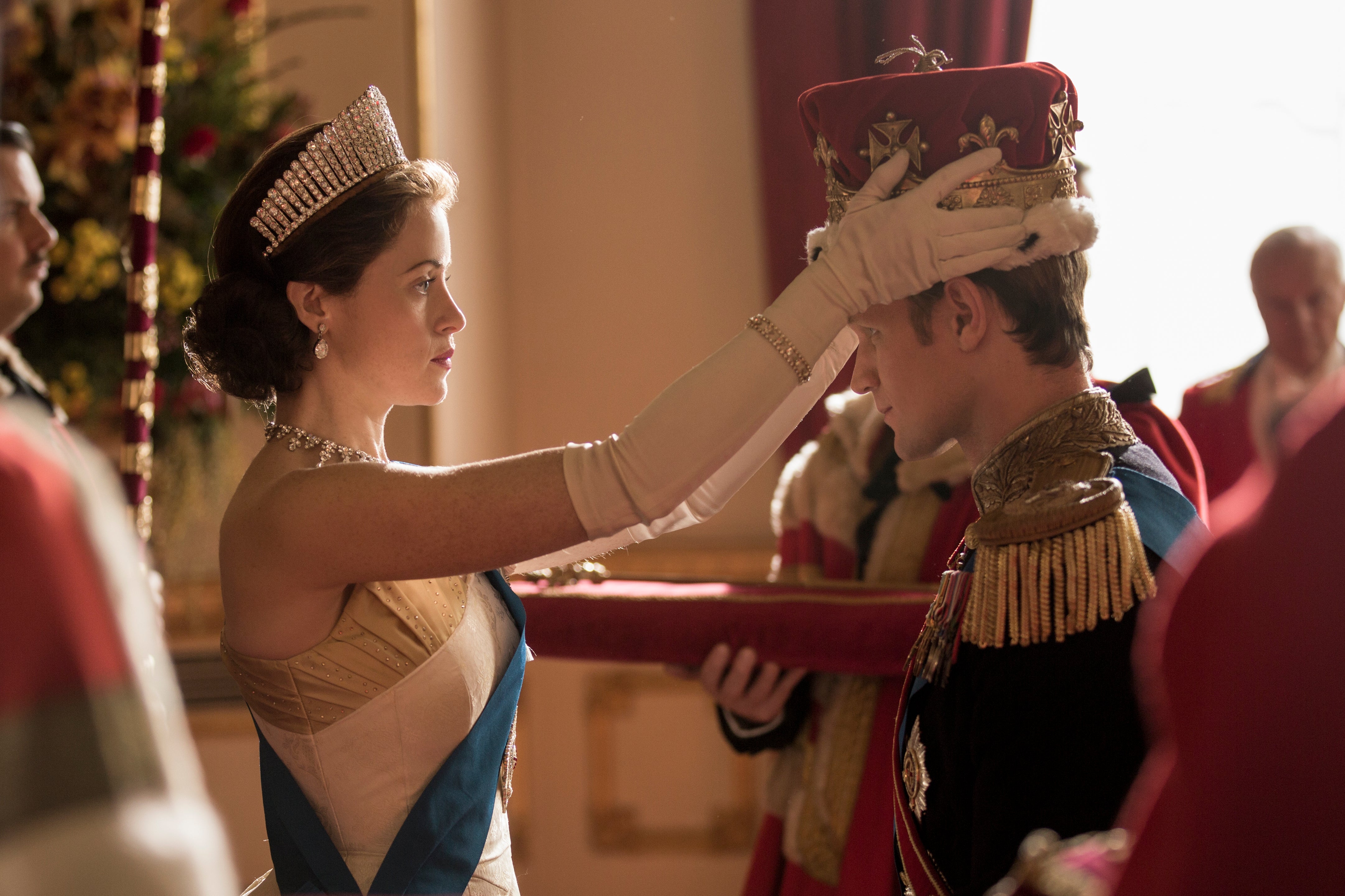 Claire Foy as Queen Elizabeth crowns Matt Smith as Prince Philip.