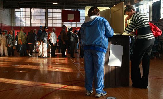 African-Americans line up to vote in a school gymnasium in the presidential election November 4, 2008 in Birmingham, Alabama.