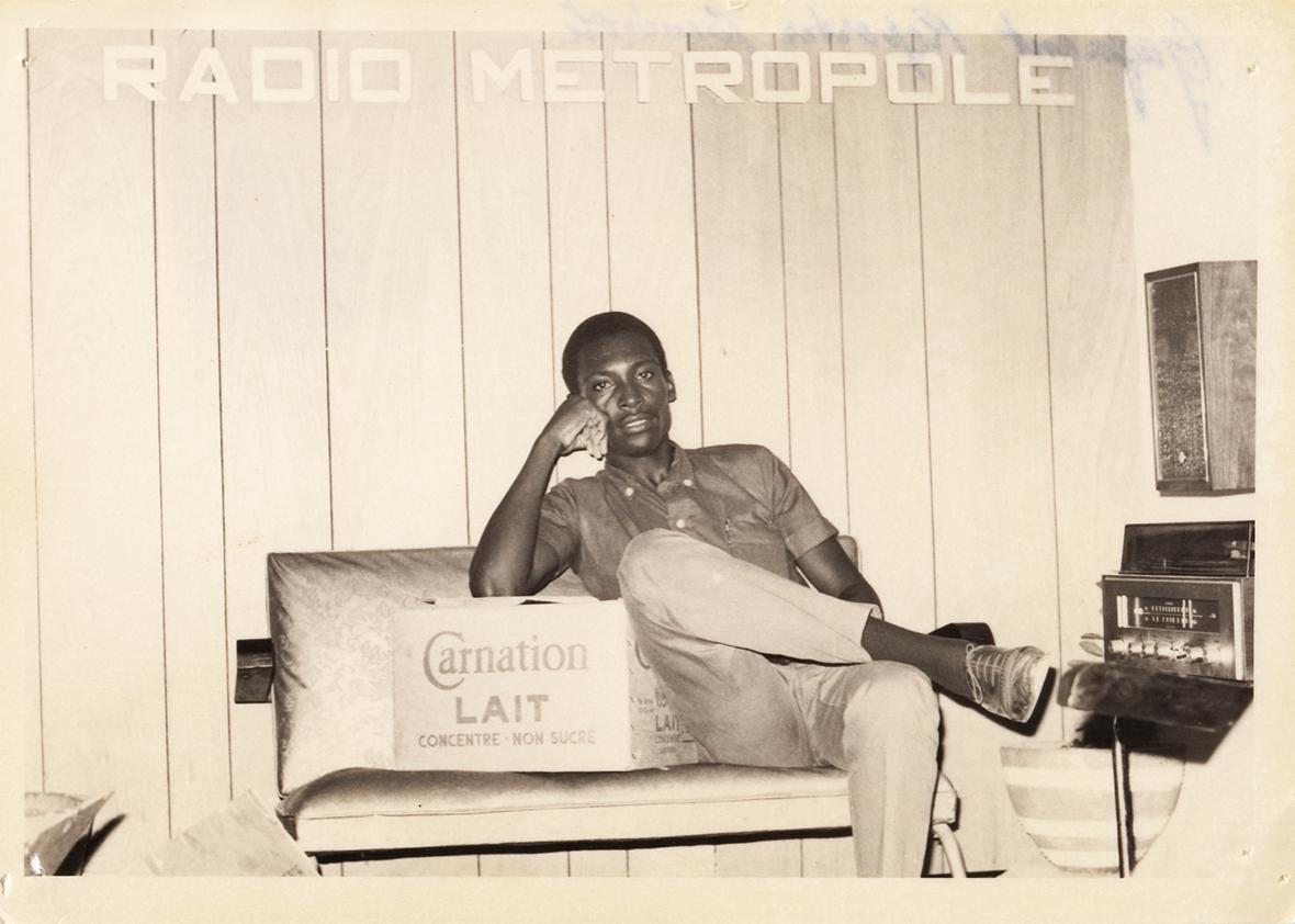 A radio technician poses for a photo at the original studios of Radio Metropole. 1960s.