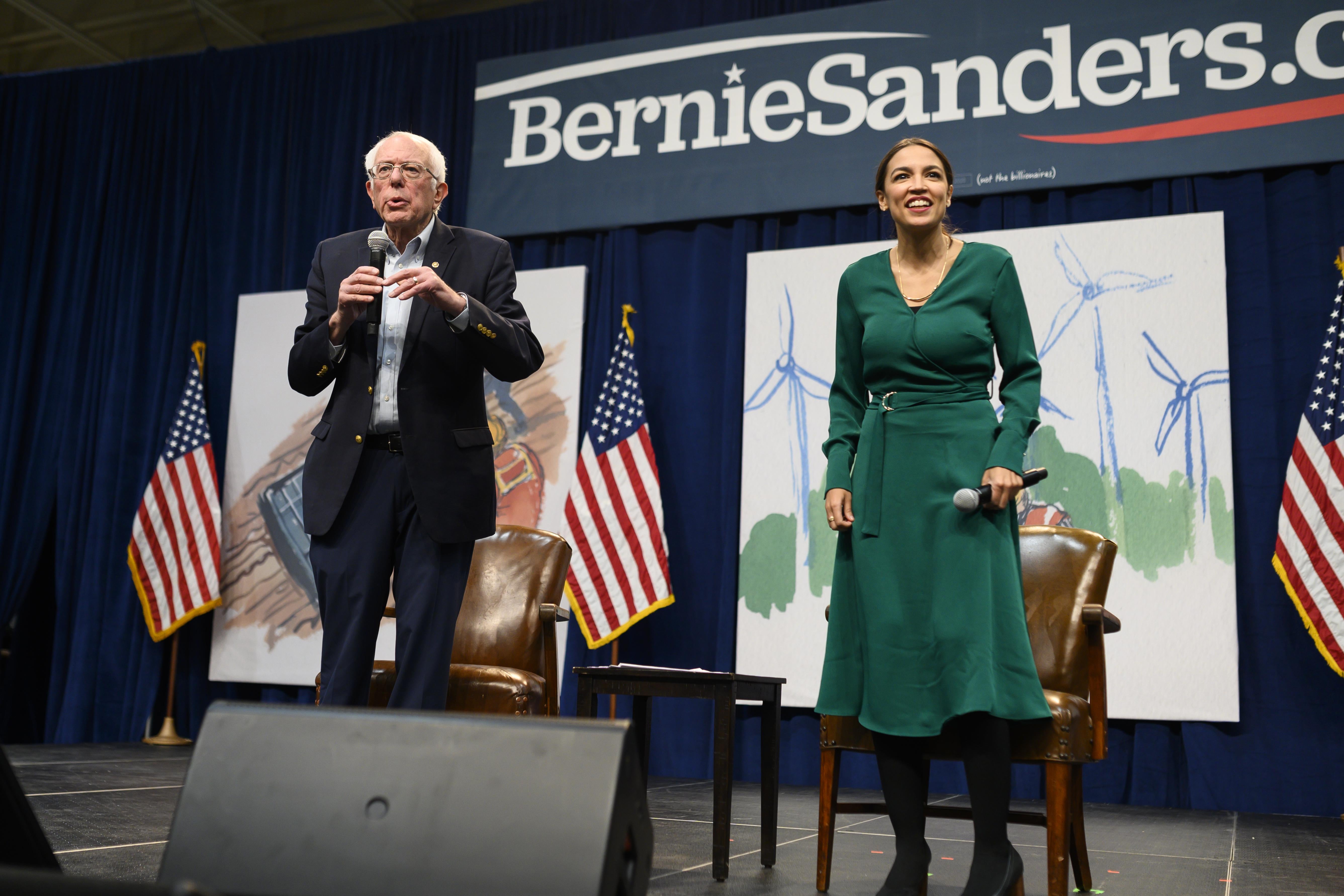 Democratic Presidential candidate Bernie Sanders and Rep. Alexandria Ocasio-Cortez field questions from audience members at the Climate Crisis Summit at Drake University on November 9, 2019 in Des Moines, Iowa.