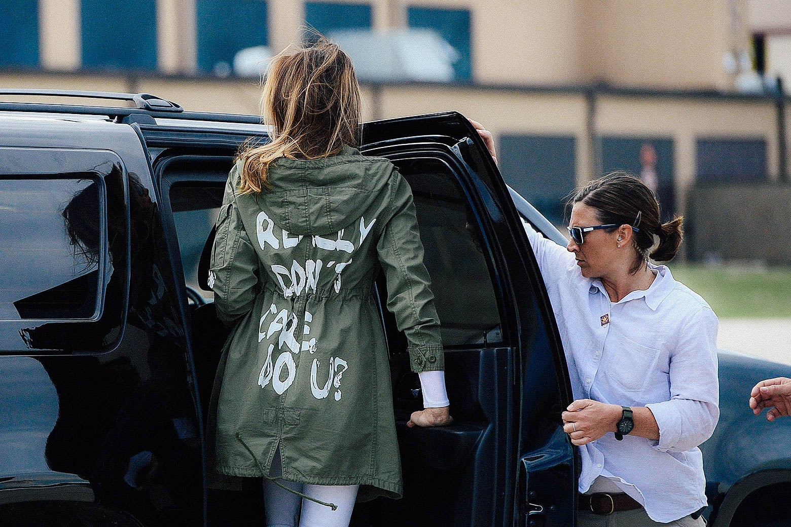 First lady Melania Trump departs Joint Base Andrews in Maryland on Thursday while wearing a jacket with the words "I really don’t care, do you?" Her back is to the camera as she enters a vehicle.