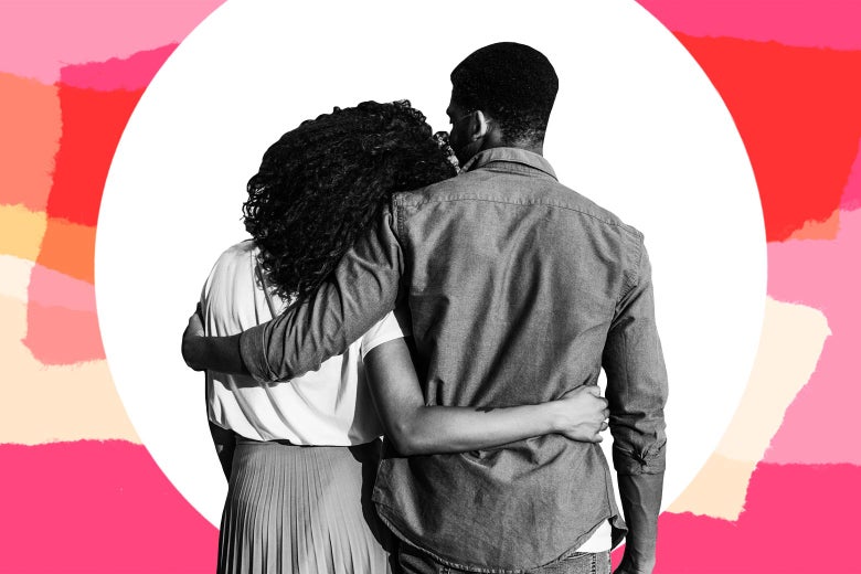 A black man and woman seen from behind with their arms around each other.