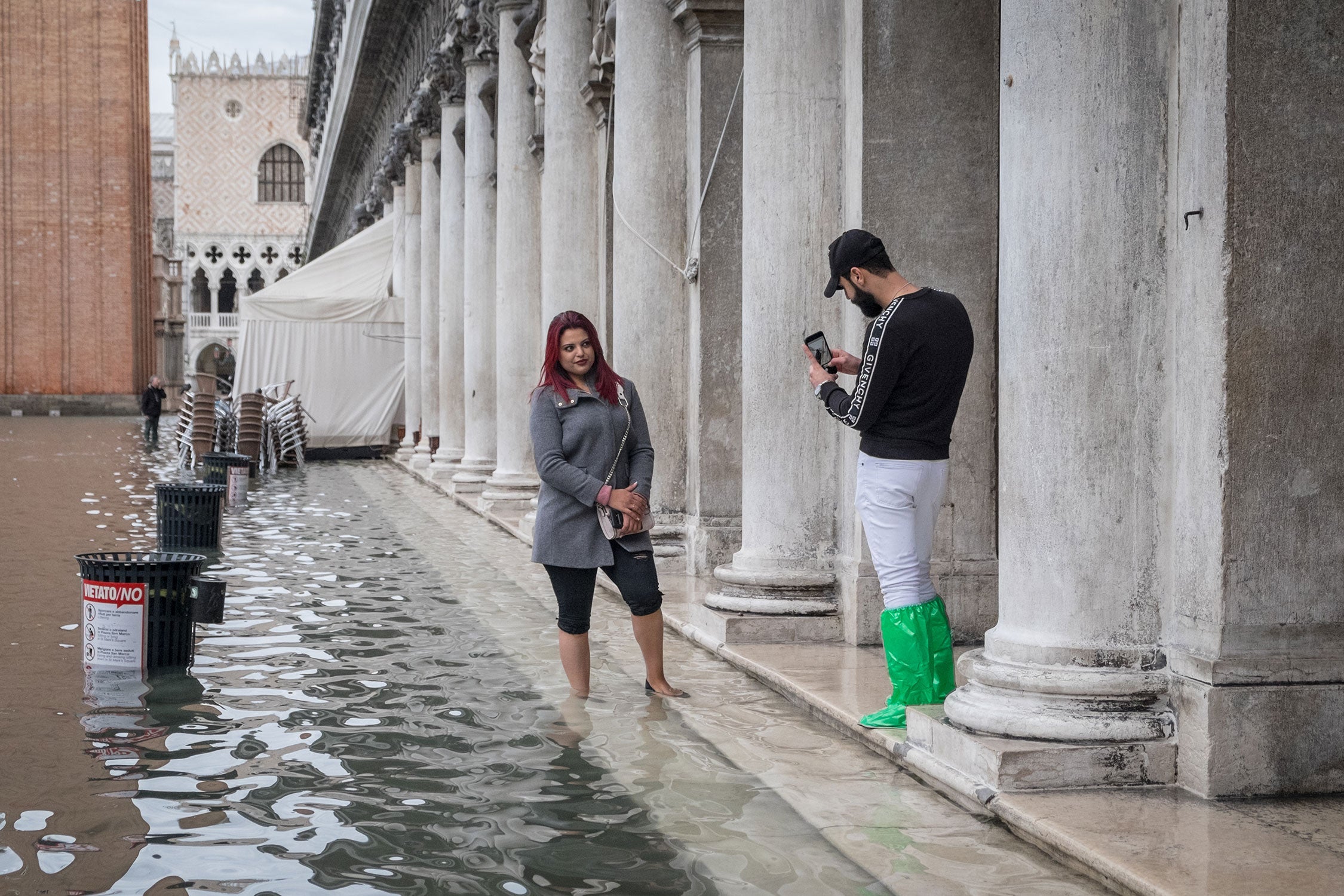 Tourists take pictures in a flooded St. Mark's Square, Nov 17th 2019, Venice.