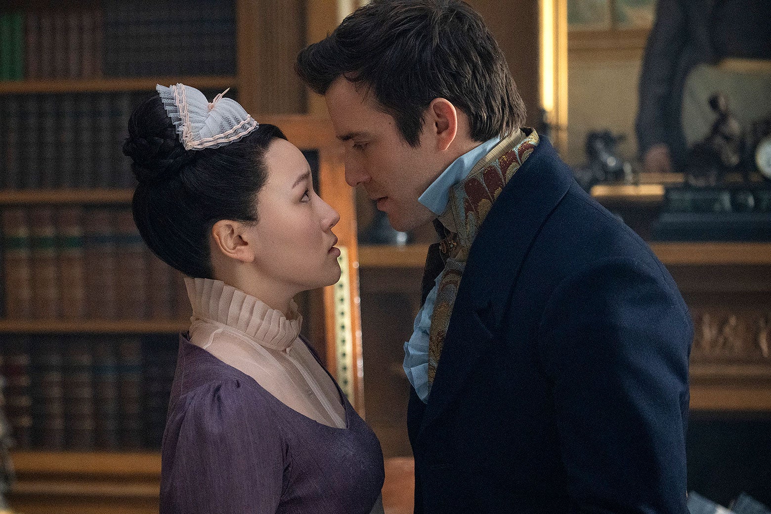 Sophie, in a maid's outfit, and Benedict, standing very close to each other.