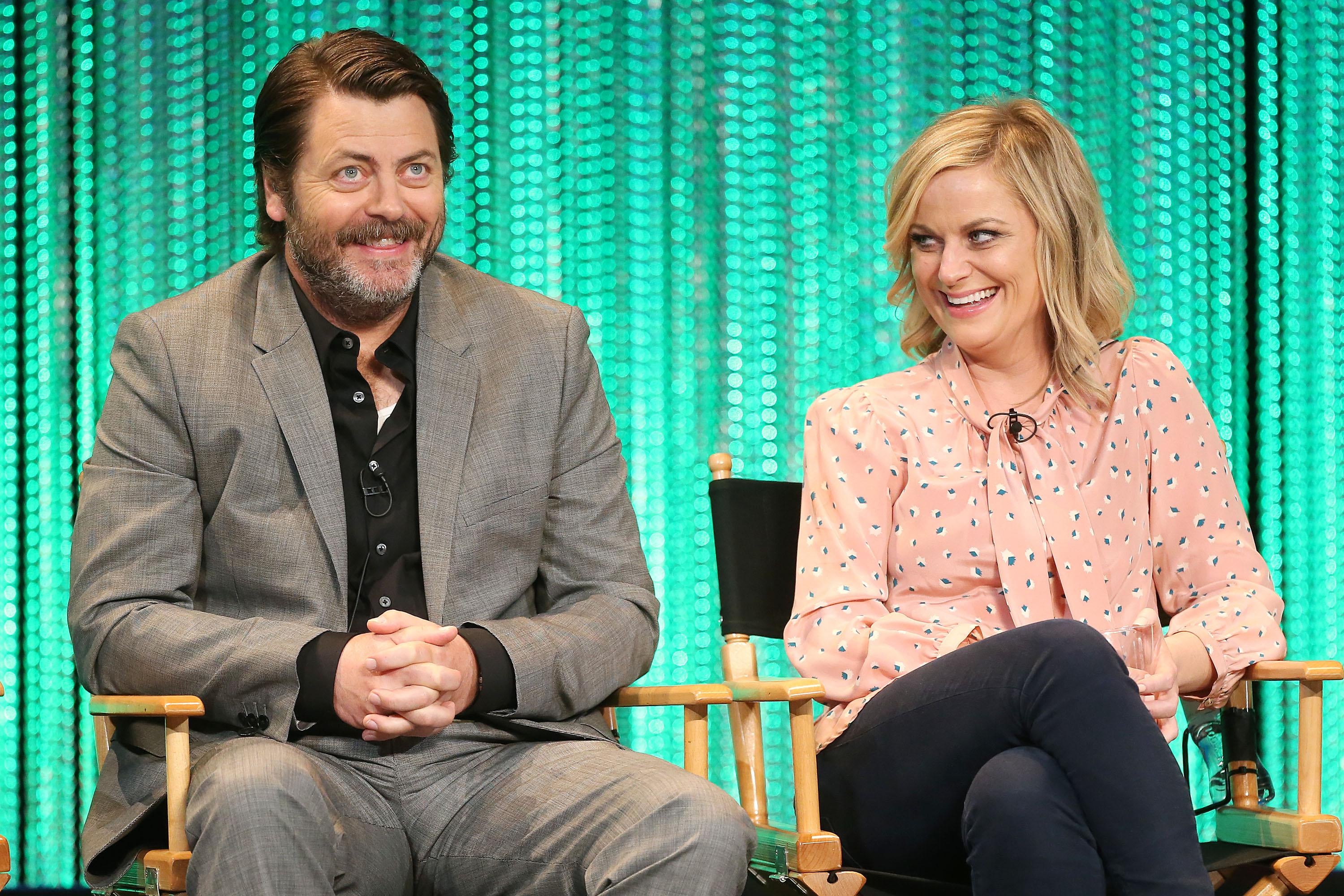 HOLLYWOOD, CA - MARCH 18: Actor Nick Offerman (L) and actress Amy Poehler speak during The Paley Center for Media's PaleyFest 2014 Honoring 'Parks and Recreation' at the Dolby Theatre on March 18, 2014 in Hollywood, California.  (Photo by Frederick M. Brown/Getty Images)