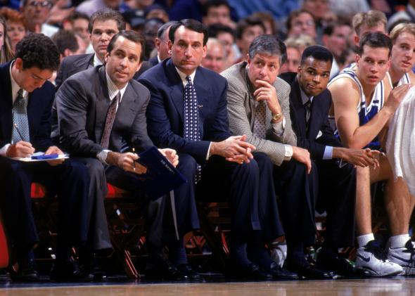 Head coach Mike Krzyzewski, center, of the Duke University Blue Devils sits with his assistants during a NCAA game against the University of Illinois.