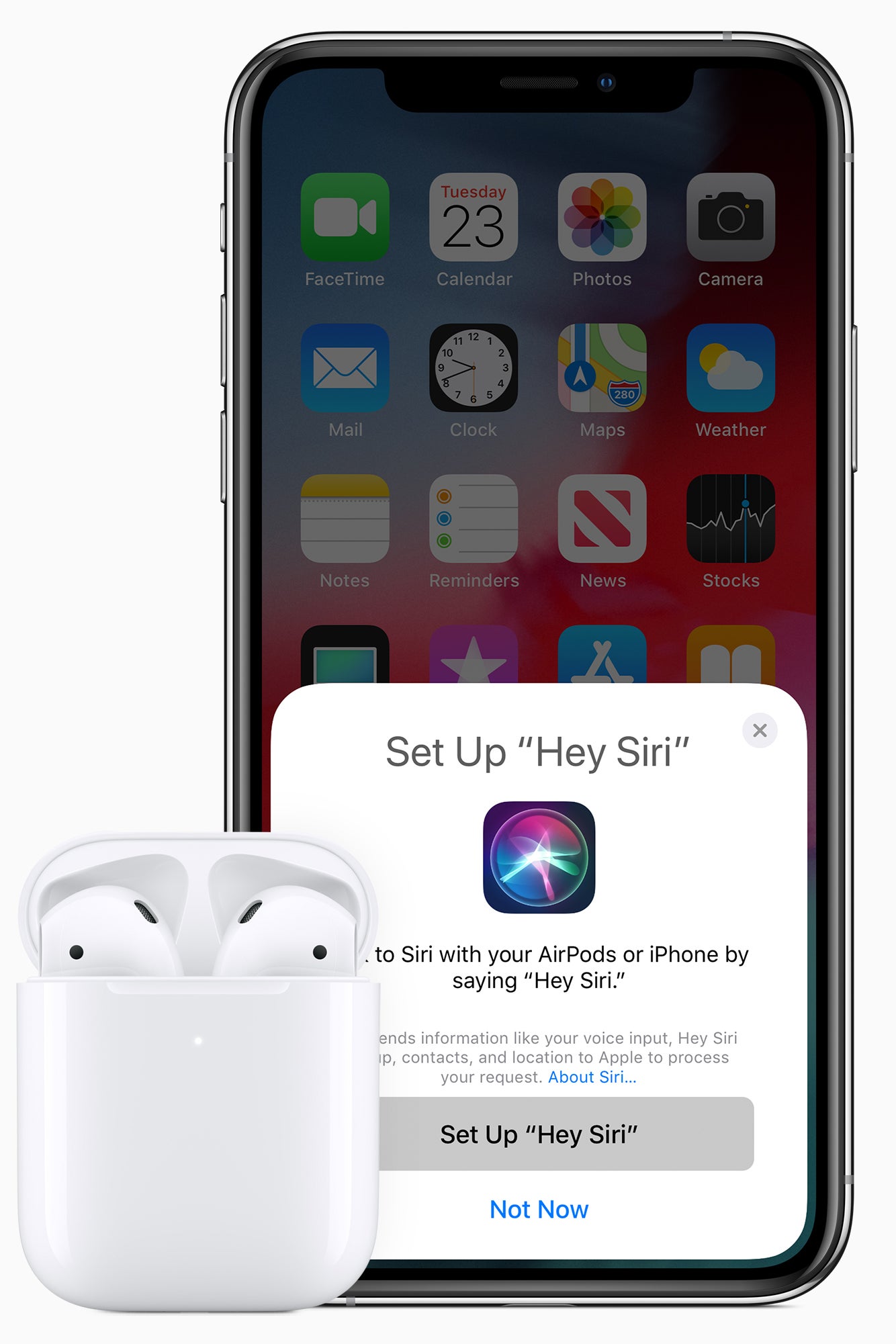 AirPods next to an iPhone whose screen says "Set up 'Hey Siri.'"