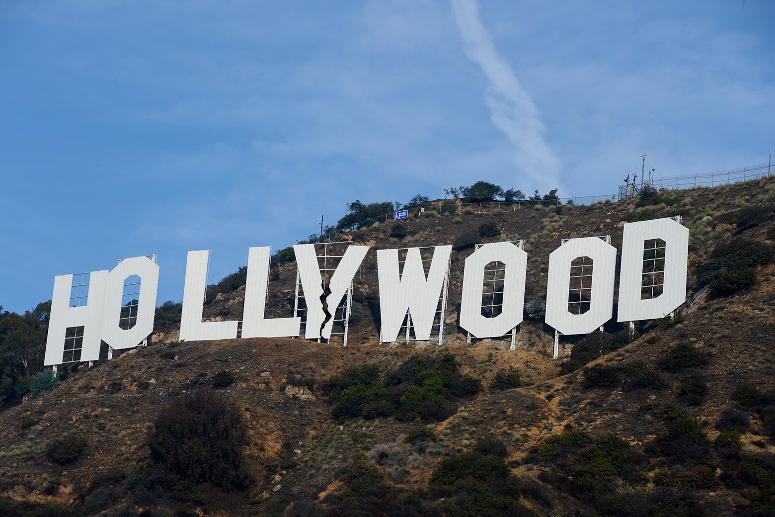 A picture of the Hollywood sign, with a schism down the middle.