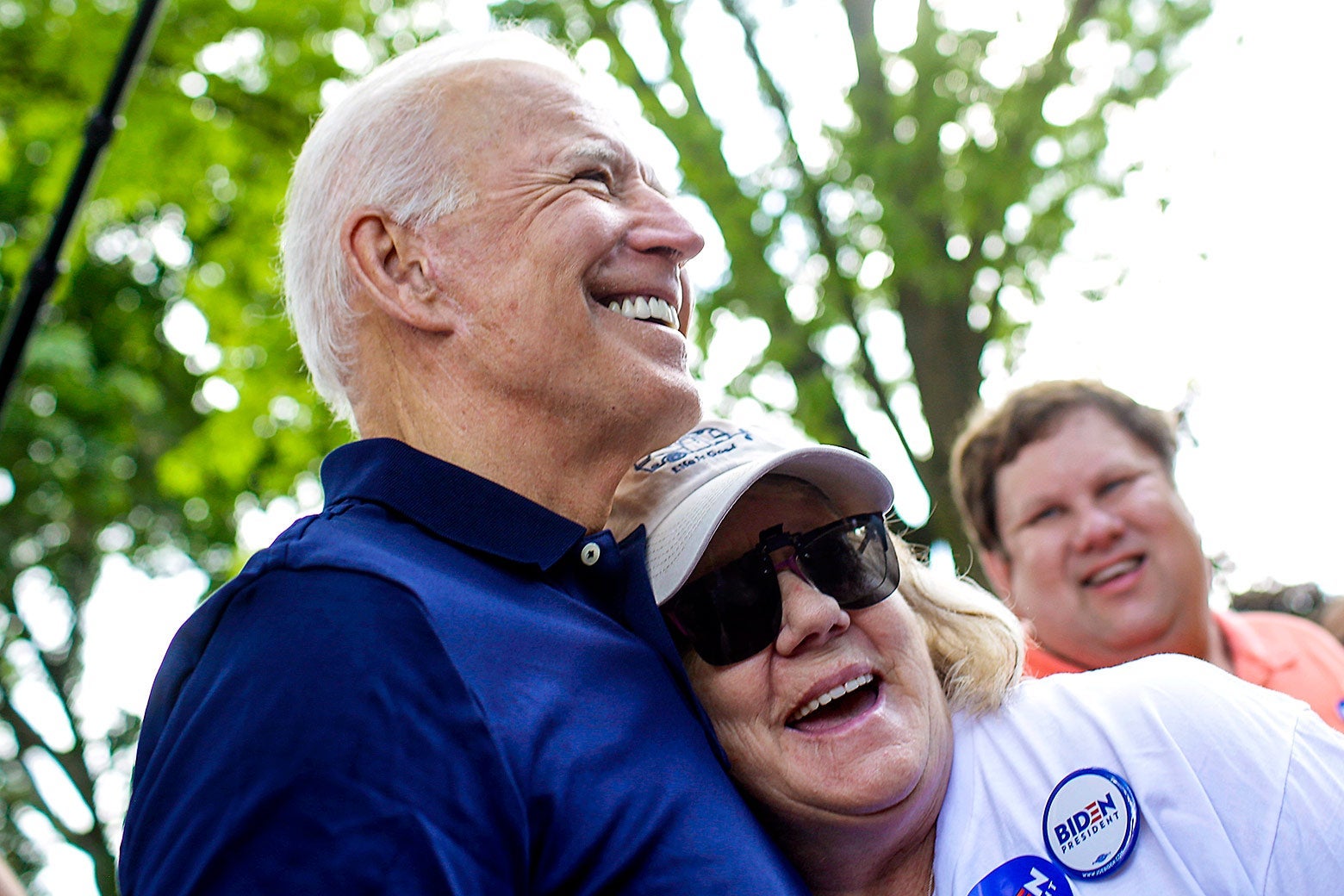 Biden hugging a smiling older woman outside