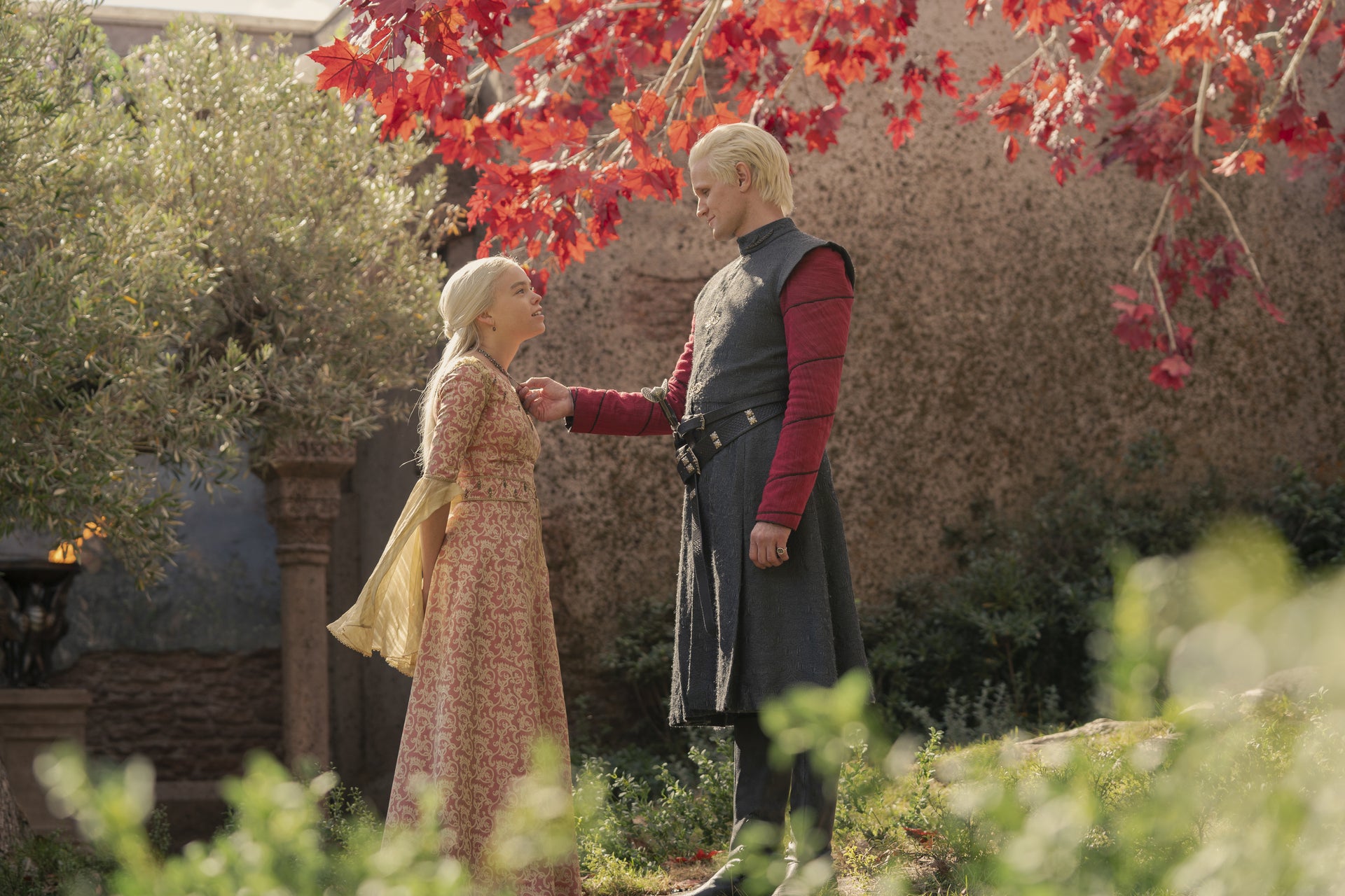 A teenage girl and a man in a garden. 