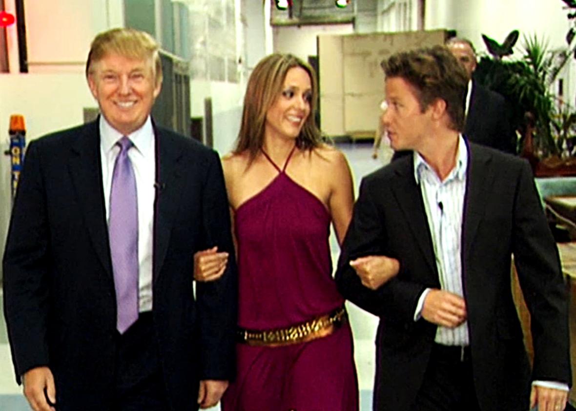 In this 2005 frame from video, Donald Trump prepares for an appearance on 'Days of Our Lives' with actress Arianne Zucker (center). He is accompanied to the set by Access Hollywood host Billy Bush. 