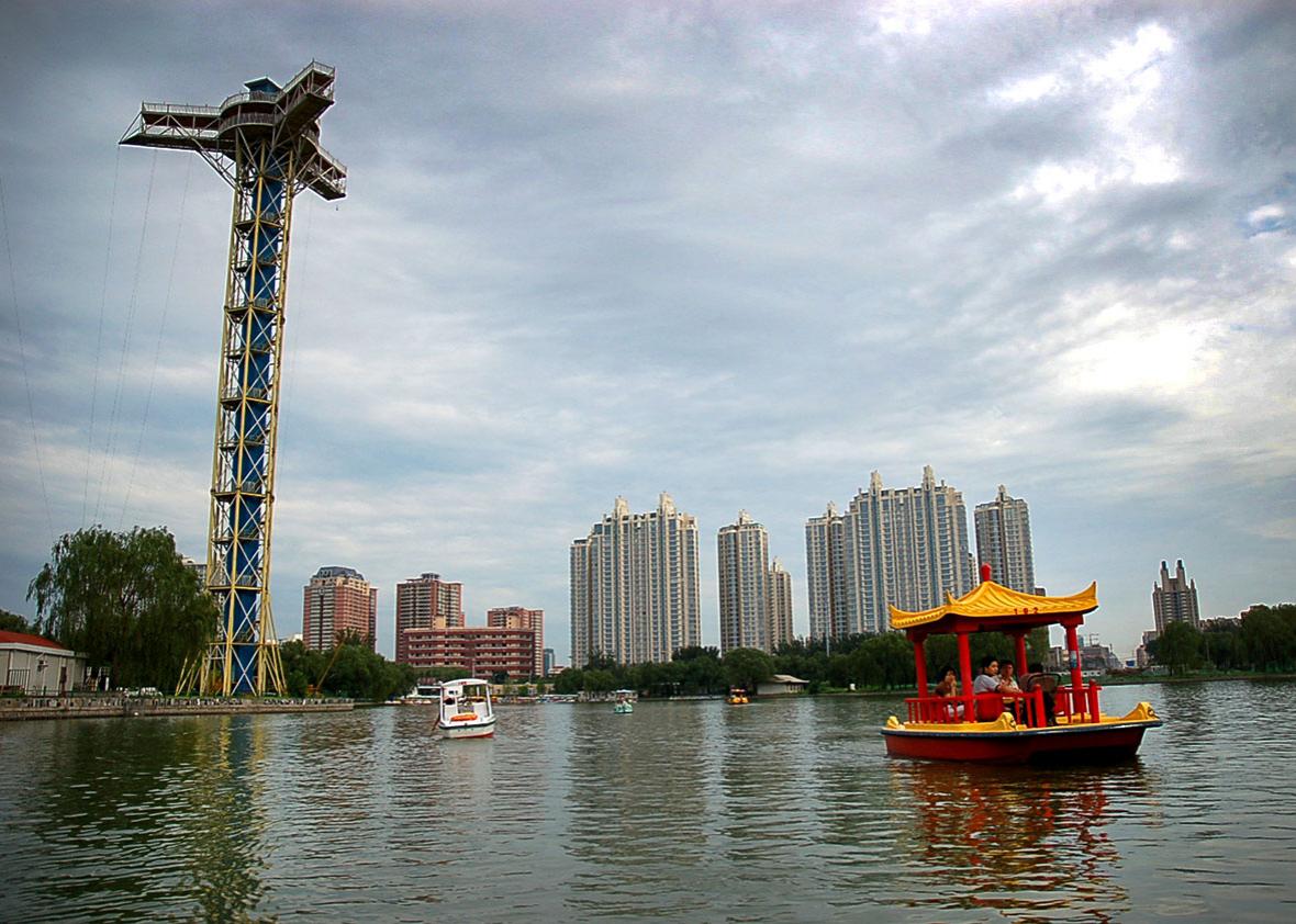 Boats float on Chaoyang Park’s lake in the Chaoyang district of Beijing, China, July 5, 2008.