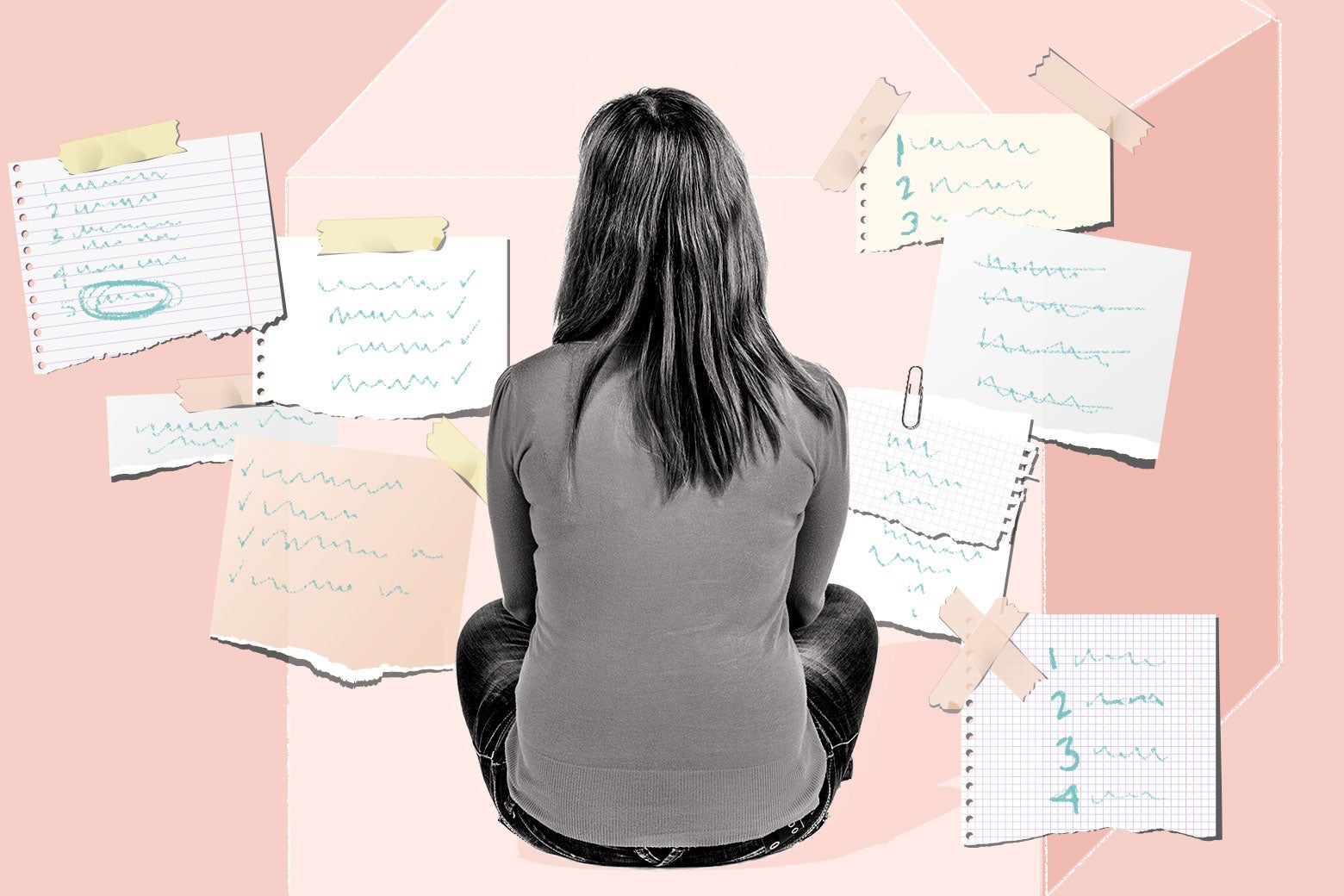 A woman sits alone amid many lists and papers.
