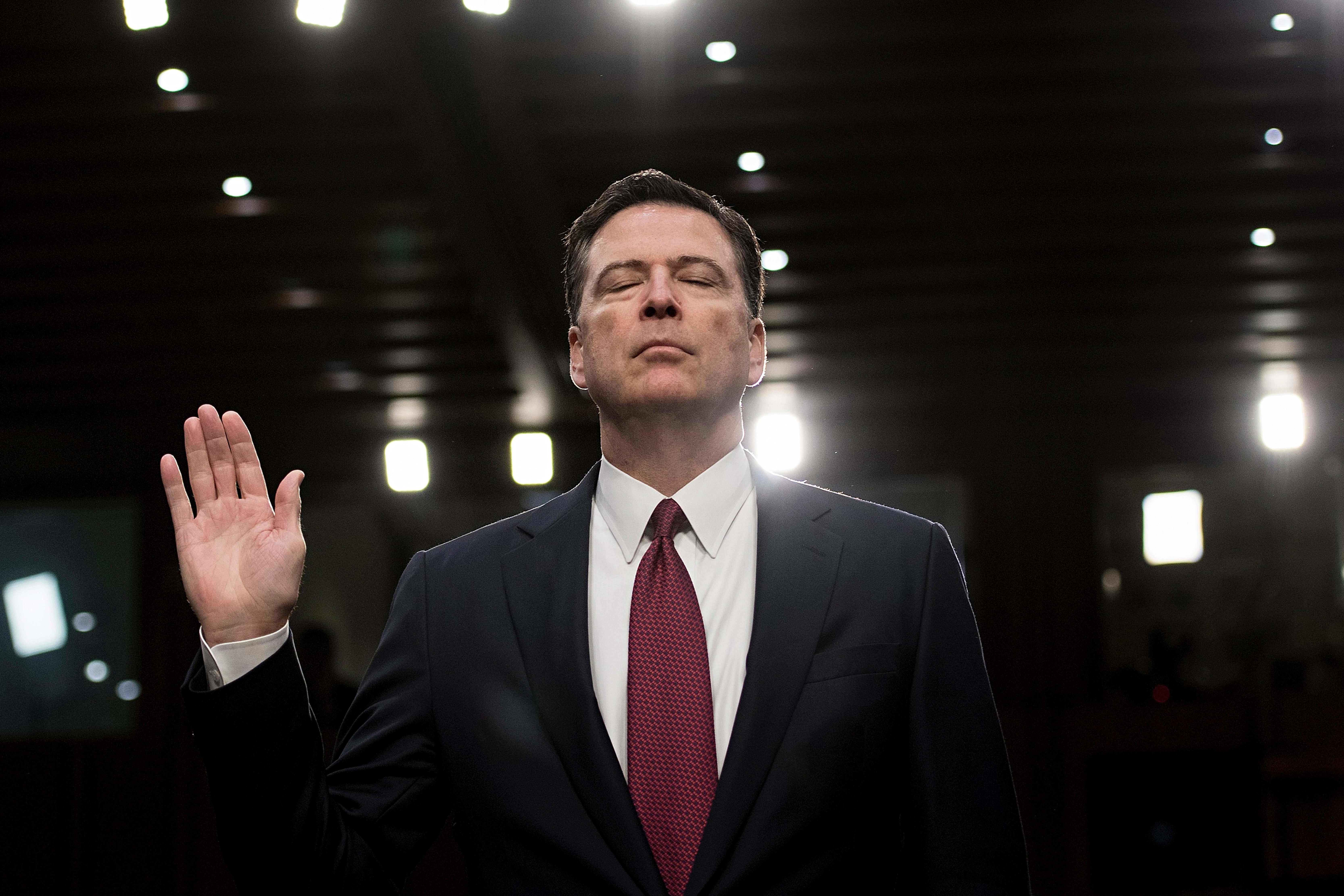 Ousted FBI director James Comey is sworn in during a hearing before the Senate Select Committee on Intelligence on Capitol Hill June 8, 2017 in Washington, D.C.