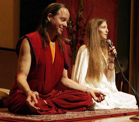 Geshe Michael Roach (L) and Christie McNally hold a yoga session at the Hong Kong Convention and Exhibition Centre, 02 June 2007.