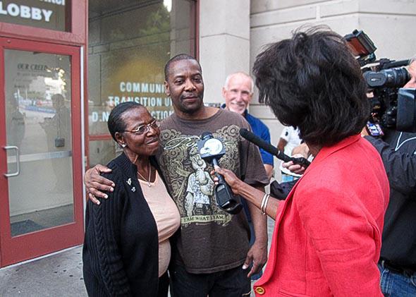 Kash Register and his mother, Wilma, speak to reporters immediately after his release from jail.