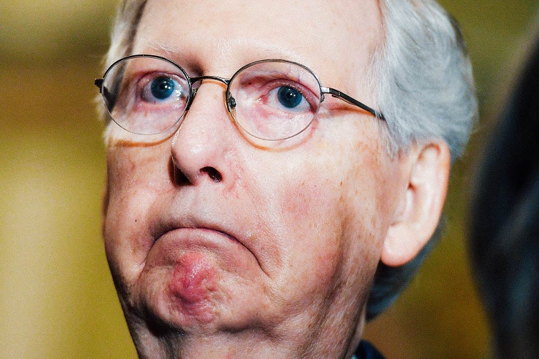 Mitch McConnell, frowning, deeply