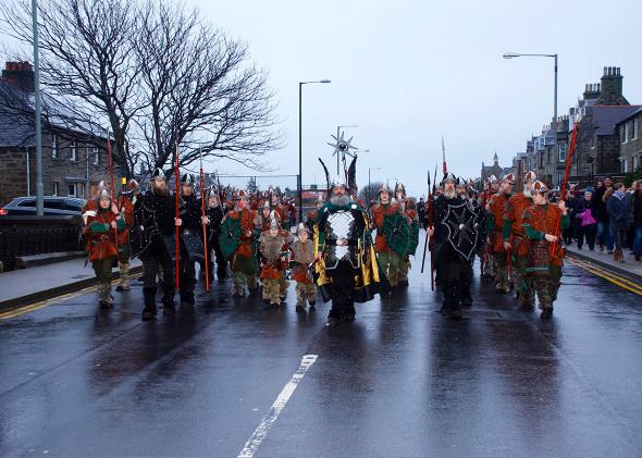 The Jarl squad march through the sodden streets of Lerwick durin,The Jarl squad march through the sodden streets of Lerwick during their morning procession.