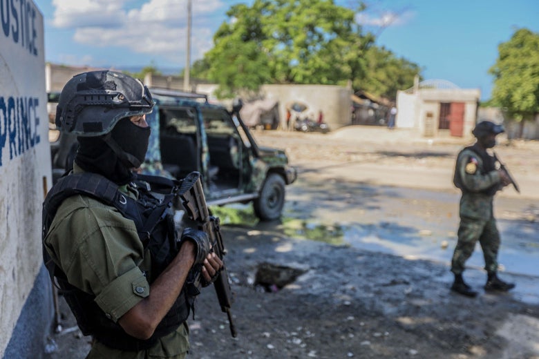 Haitian soldiers guard the Public Prosecutor's office in Port-au-Prince on October 6, 2021. 