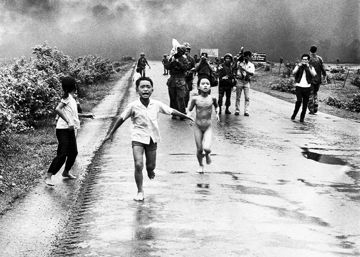 Vietnamese children flee from their homes in the South Vietnamese village of Trang Bang after South Vietnamese planes accidently dropped a napalm bomb on the village, located 26 miles outside of Saigon. 