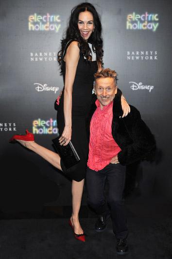 L'Wren Scott and Simon Doonan attend the Electric Holiday Window Unveiling, presented by Barneys New York and Disney, in November 2012 in New York City.